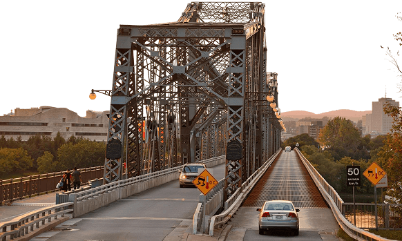Steel truss bridge representing infrastructure reach